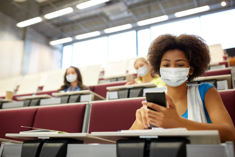 Female student in class on phone