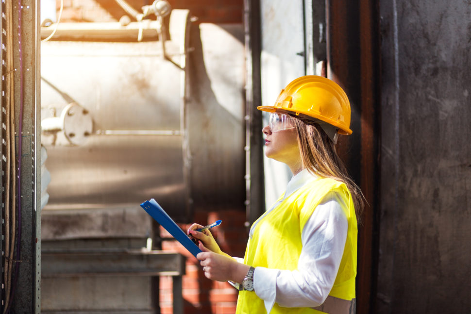 a woman inspects equipment