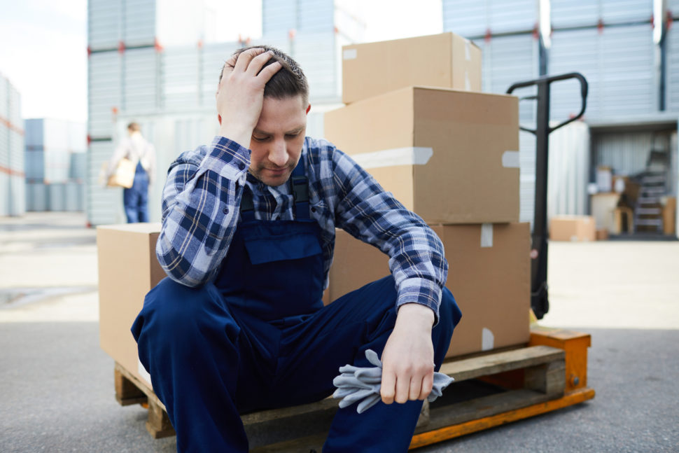 tired worker sits and rests