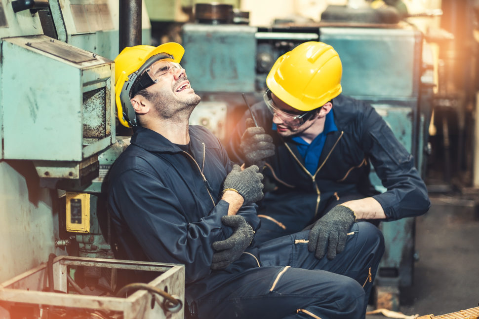 injured worker helped by another worker