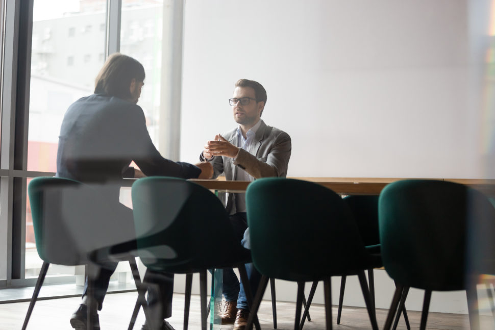 two workers talk