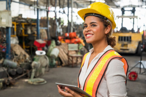 Safety manager looking out and holding iPad